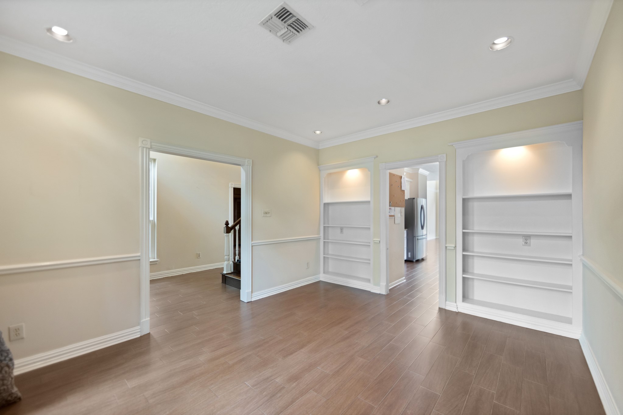 5115 Westerham Place Houston, TX 77069 - Photo 19 of 50 wooden floor in an empty room with a window