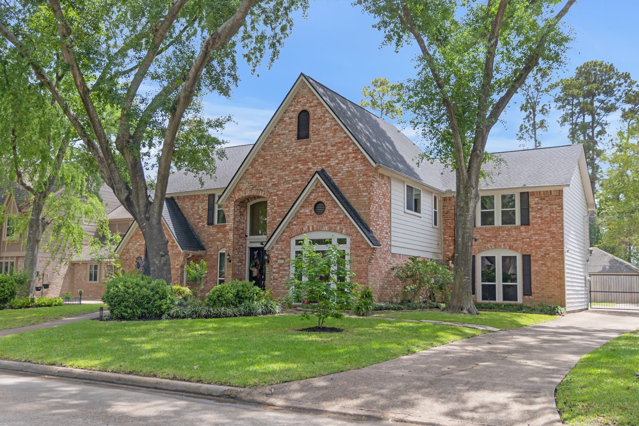 5115 Westerham Place Houston, TX 77069 - Photo 2 of 50 a front view of a house with a yard