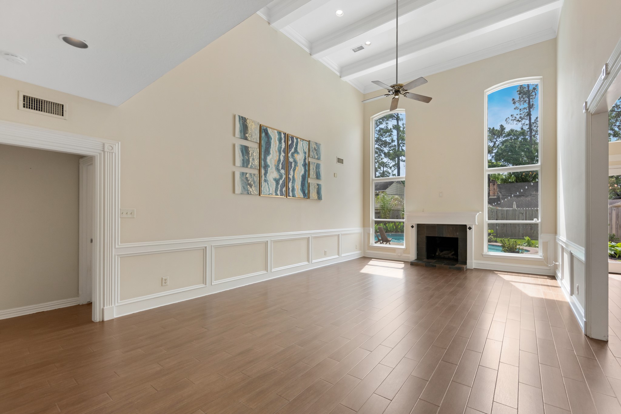 5115 Westerham Place Houston, TX 77069 - Photo 23 of 50 a view of an empty room with wooden floor fireplace and a window
