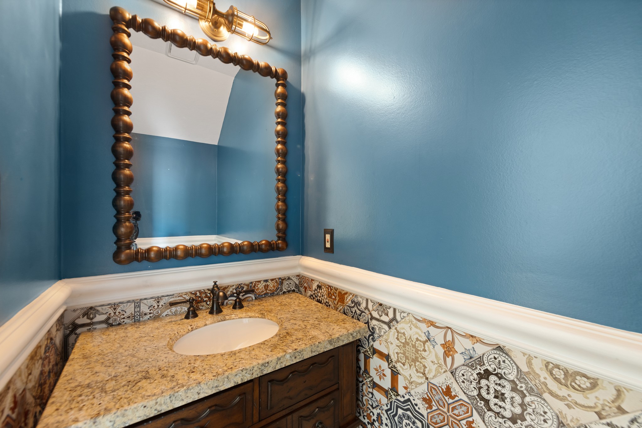 5115 Westerham Place Houston, TX 77069 - Photo 27 of 50 a bathroom with a granite countertop sink and a mirror