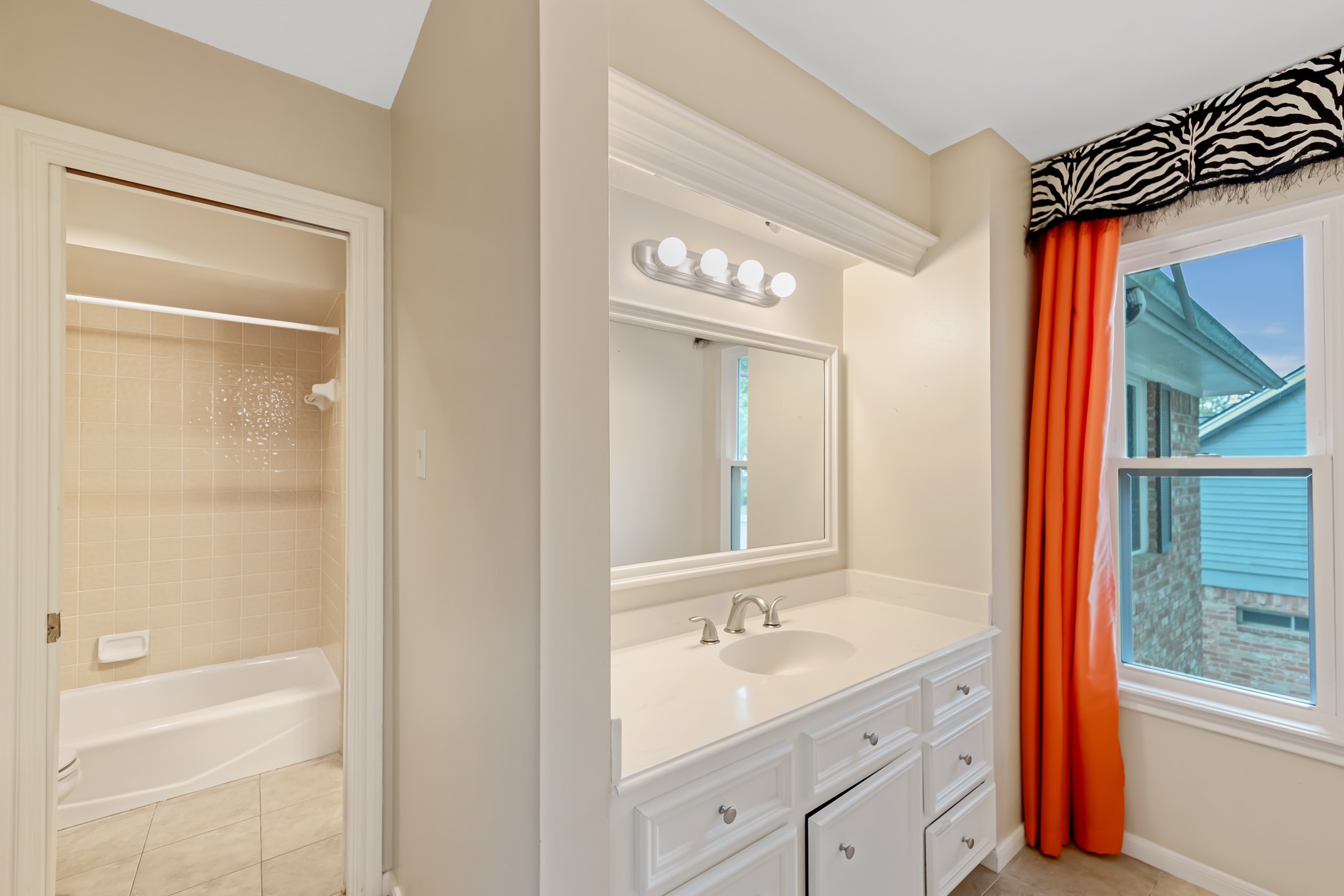 5115 Westerham Place Houston, TX 77069 - Photo 35 of 50 a bathroom with a sink a toilet and shower