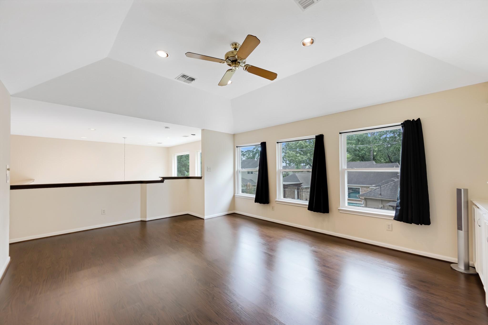 5115 Westerham Place Houston, TX 77069 - Photo 39 of 50 a view of an empty room with wooden floor and a window