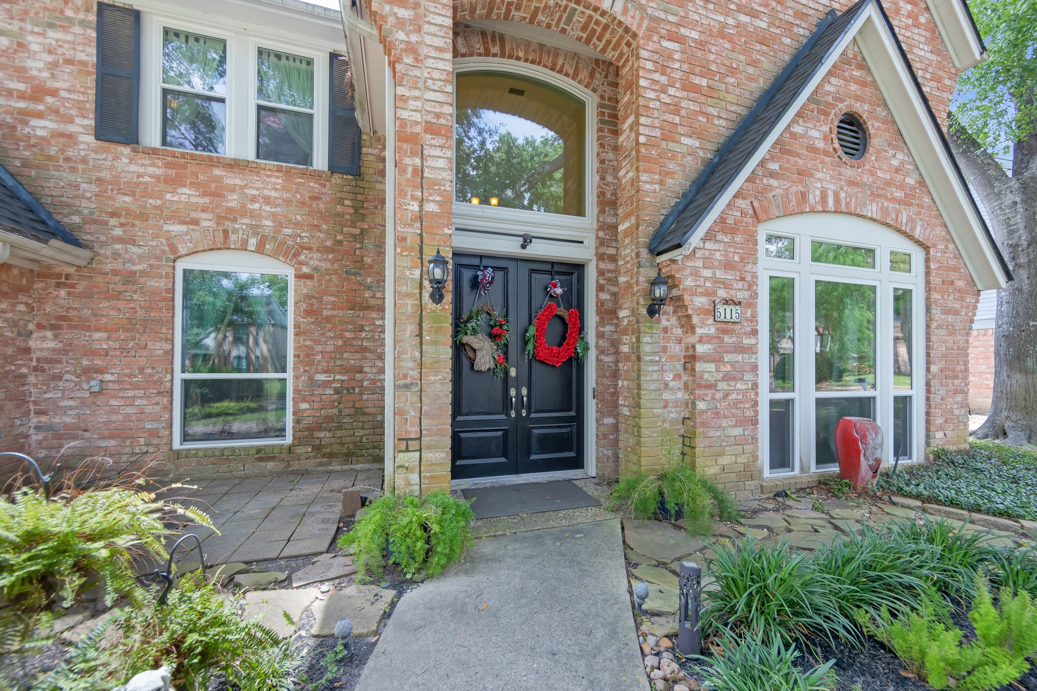 5115 Westerham Place Houston, TX 77069 - Photo 5 of 50 a front view of a house with a porch