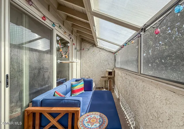 a view of a house with pool and chairs
