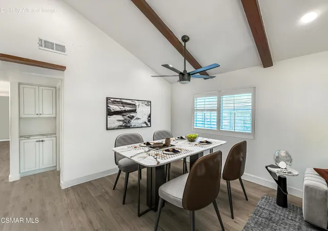a dining room with furniture and window