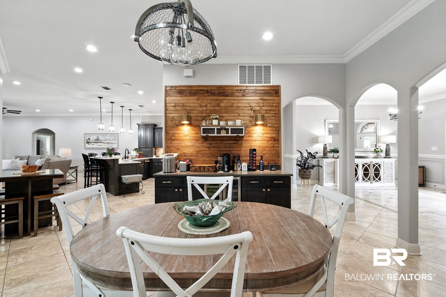23357 Carnoustie Drive Foley, AL 36535 - Photo 16 of 99 Dining area featuring arched walkways, crown molding, recessed lighting, and light tile patterned floors