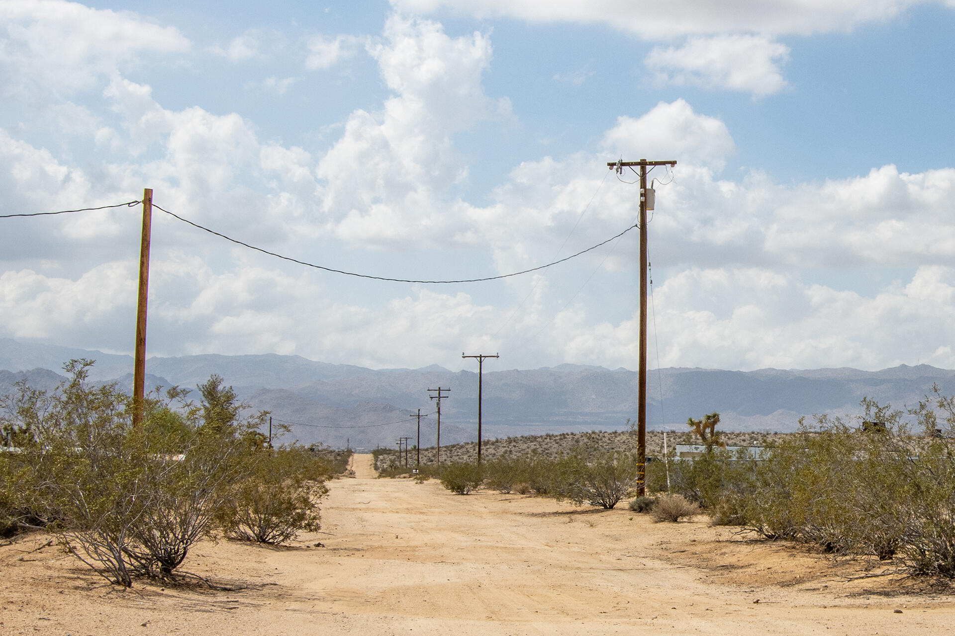 401 Stonehill Avenue Joshua Tree, CA 92252 - Photo 2 of 20 a view of a water fountain in front of a house