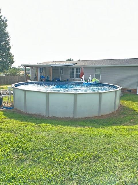 1109 Peppertree Drive Stanley, NC 28164 - Photo 4 of 9 a view of a swimming pool with a yard