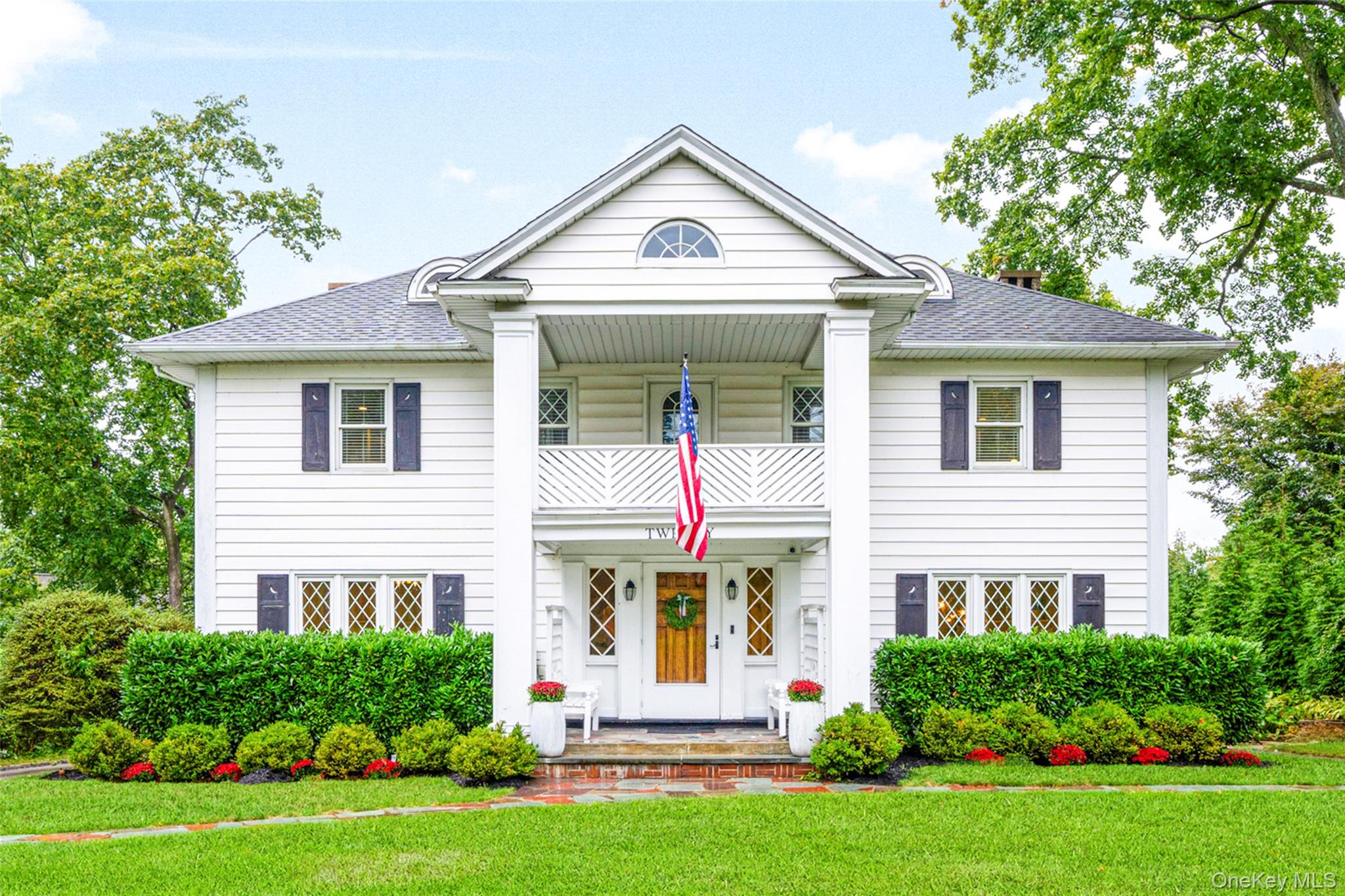 20 Elk Avenue New Rochelle, NY 10804 - Photo 1 of 40 a front view of a house with a yard and trees