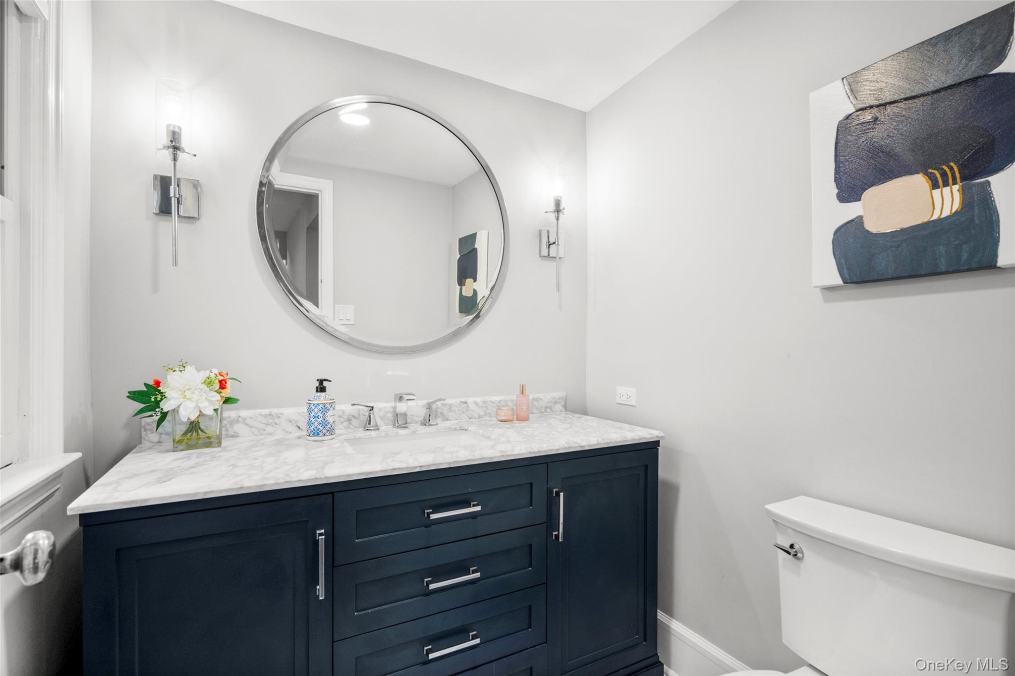 20 Elk Avenue New Rochelle, NY 10804 - Photo 20 of 40 a bathroom with a sink and a mirror