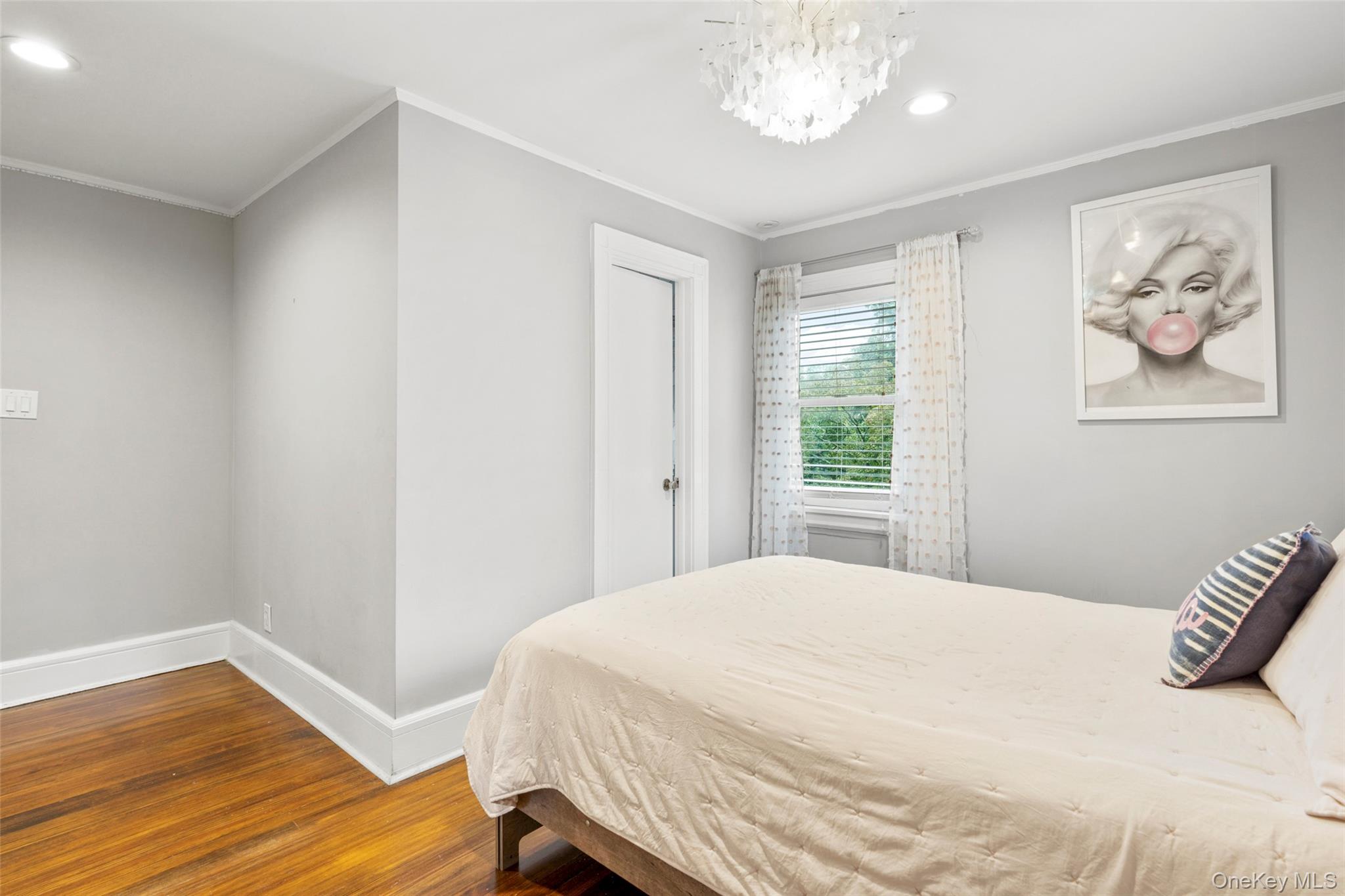 20 Elk Avenue New Rochelle, NY 10804 - Photo 24 of 40 a bedroom with a bed and a window