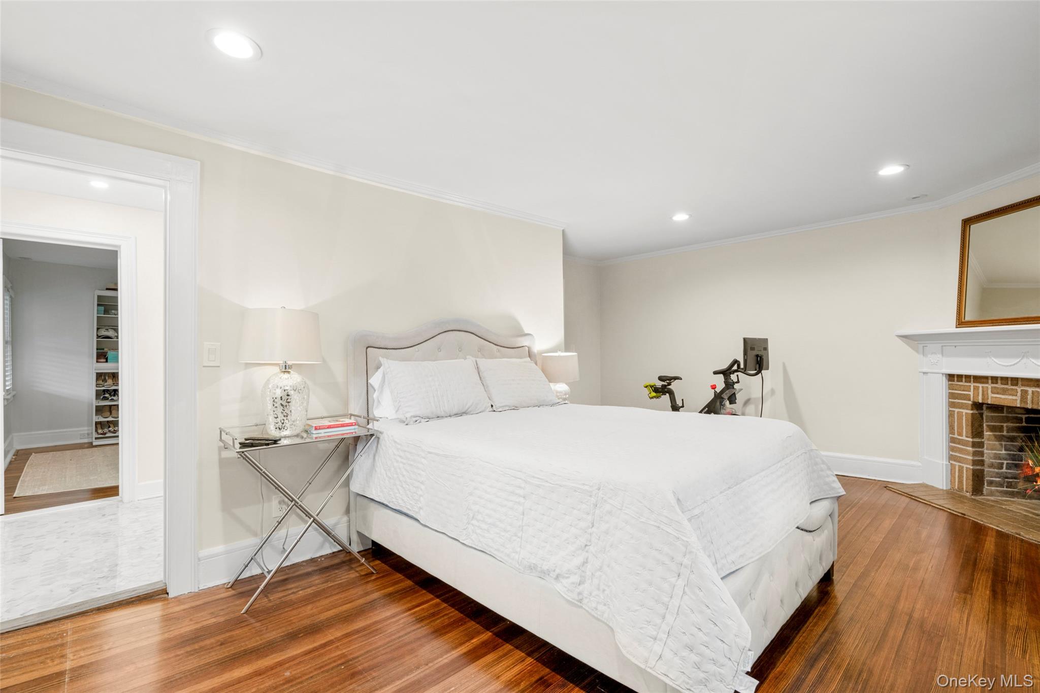 20 Elk Avenue New Rochelle, NY 10804 - Photo 27 of 40 a bedroom with a bed and a fireplace