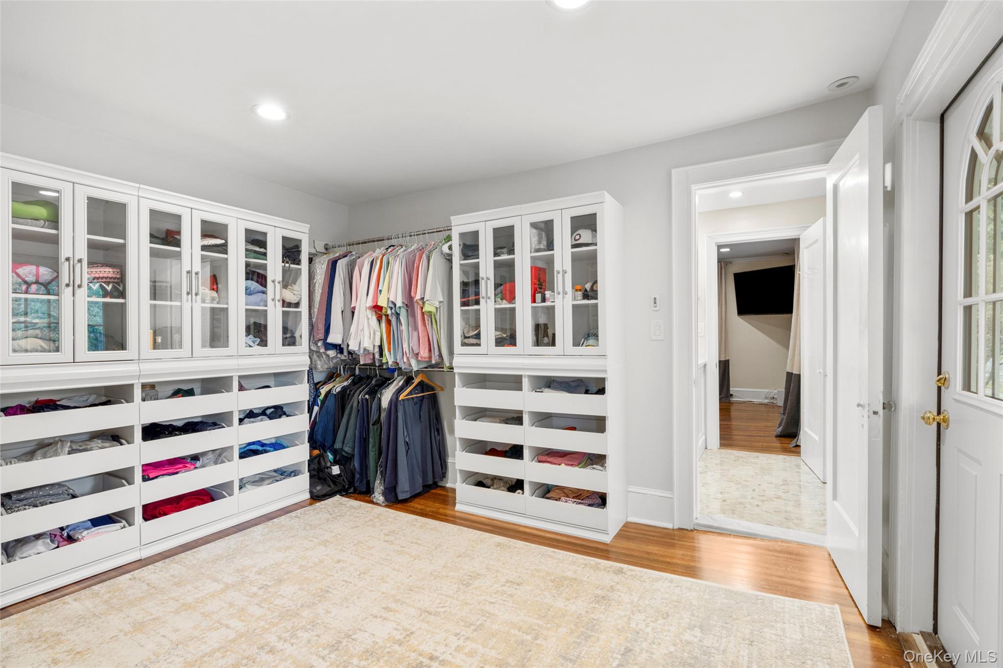 20 Elk Avenue New Rochelle, NY 10804 - Photo 30 of 40 a view of walk in closet with clothes and shoes