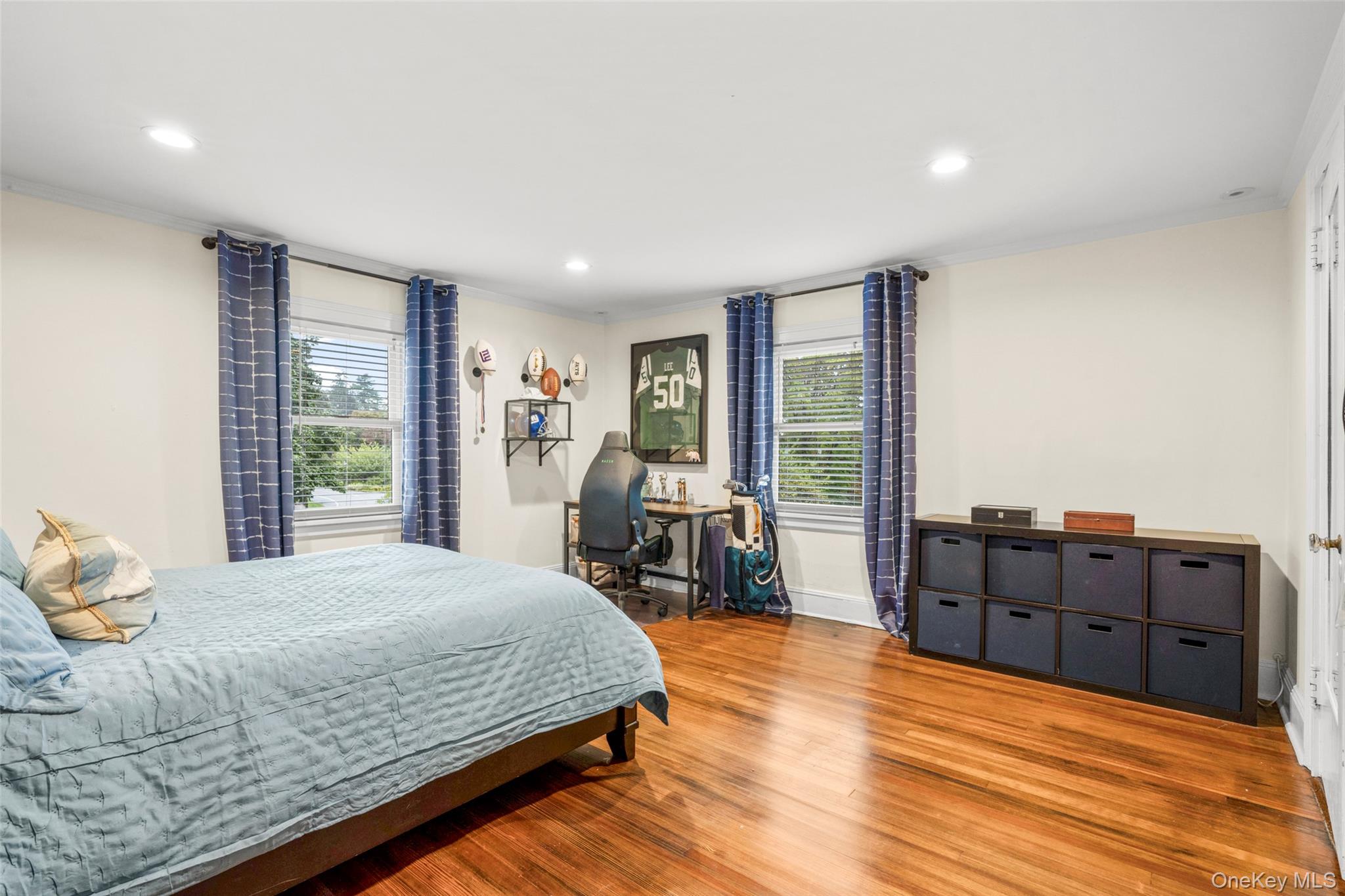 20 Elk Avenue New Rochelle, NY 10804 - Photo 31 of 40 a bedroom with a bed and wooden floor