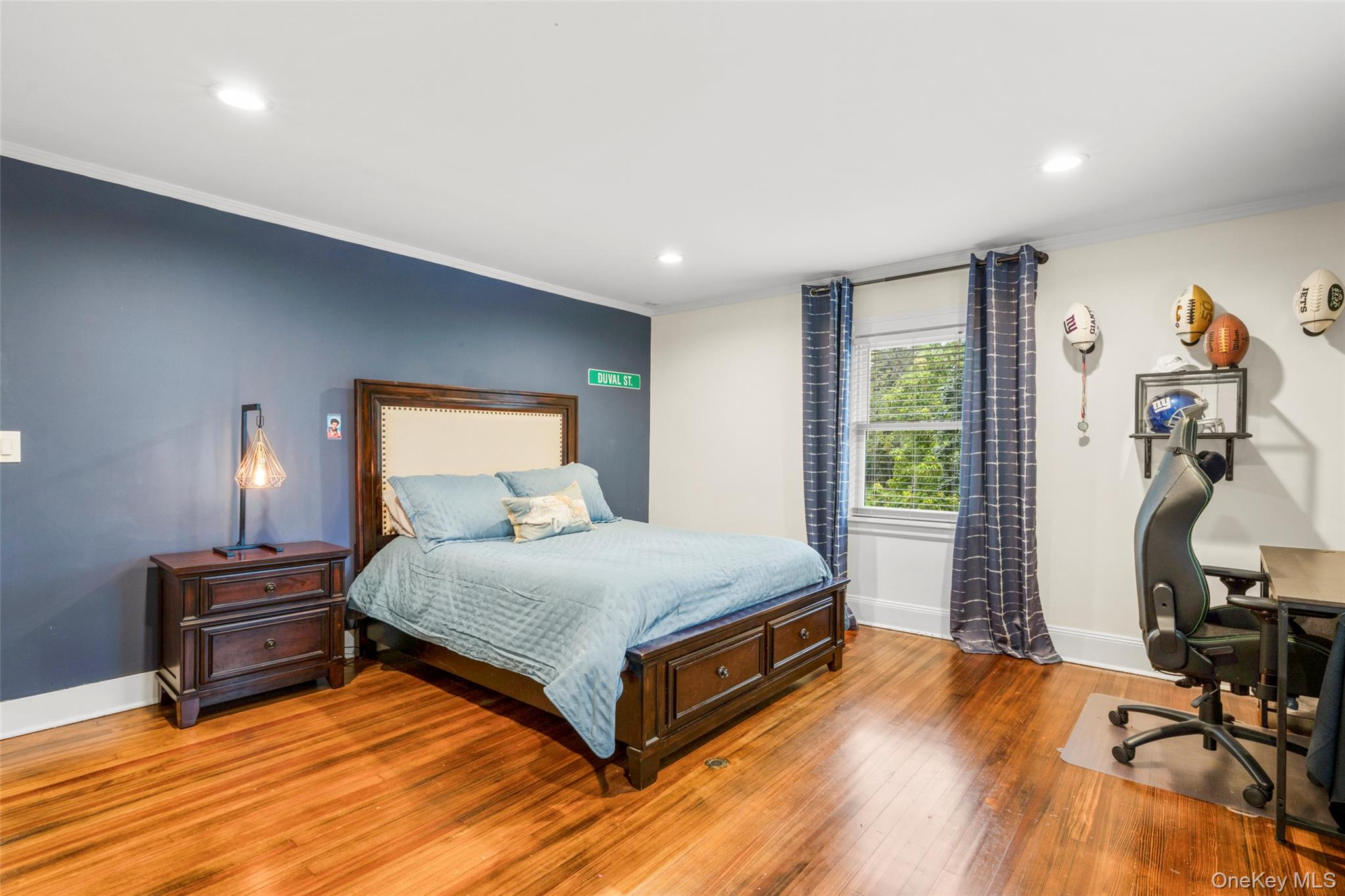 20 Elk Avenue New Rochelle, NY 10804 - Photo 32 of 40 a spacious bedroom with a bed and a desk in it