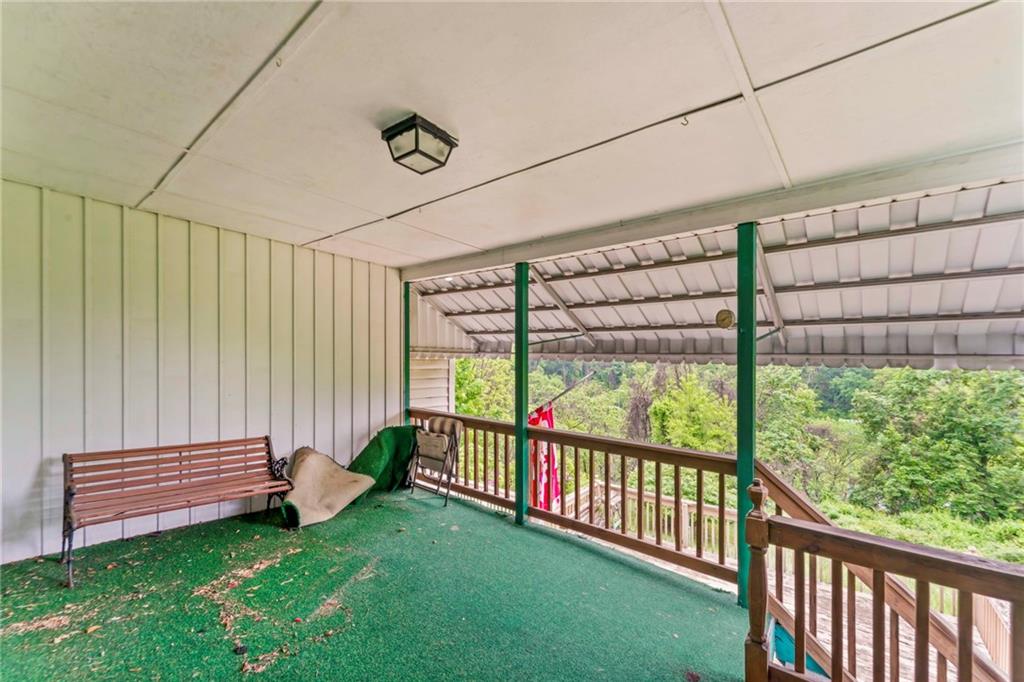 1908 St Paul Street Pittsburgh, PA 15203 - Photo 25 of 28 a view of a porch with a yard