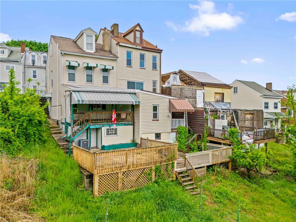 1908 St Paul Street Pittsburgh, PA 15203 - Photo 27 of 28 a view of house with a yard and deck