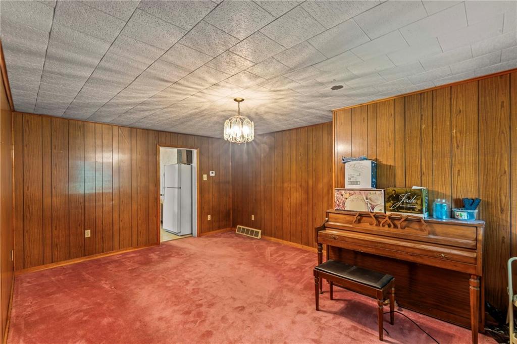 1908 St Paul Street Pittsburgh, PA 15203 - Photo 9 of 28 a bedroom with furniture and a chandelier