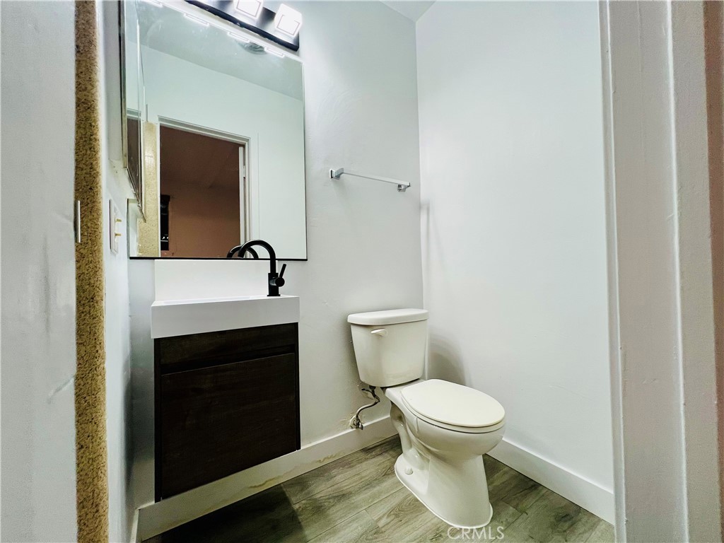 1449 South Point View Street Los Angeles, CA 90035 - Photo 5 of 11 a bathroom with a toilet and a sink