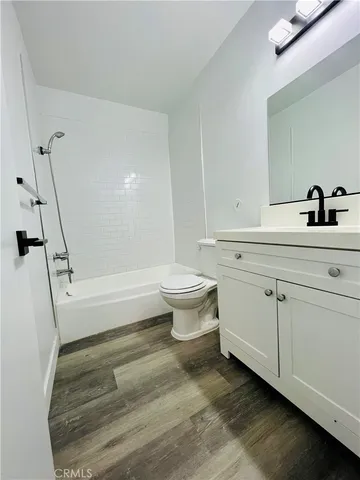 a bathroom with a sink a toilet and a bathtub