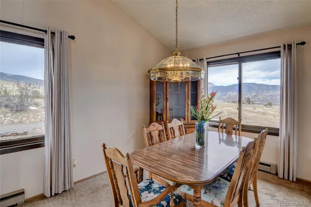 a kitchen with stainless steel appliances granite countertop a sink refrigerator and window
