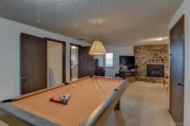 a view of a livingroom with furniture and a flat screen tv