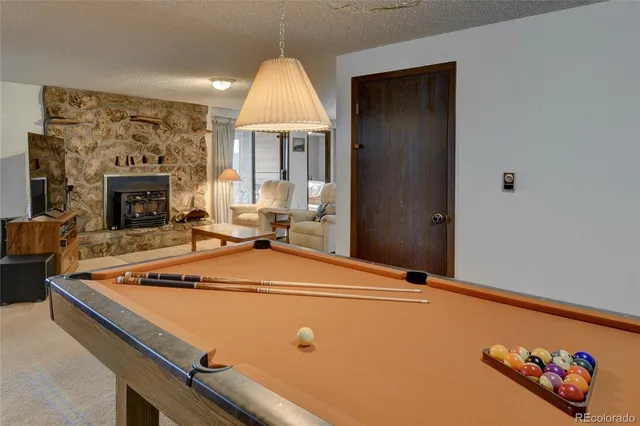 a view of a livingroom with workspace and a couch