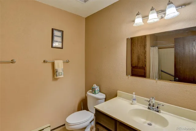 a bathroom with a shower and a glass door
