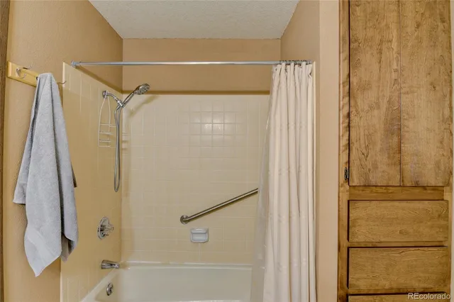 a bedroom with bed and a window