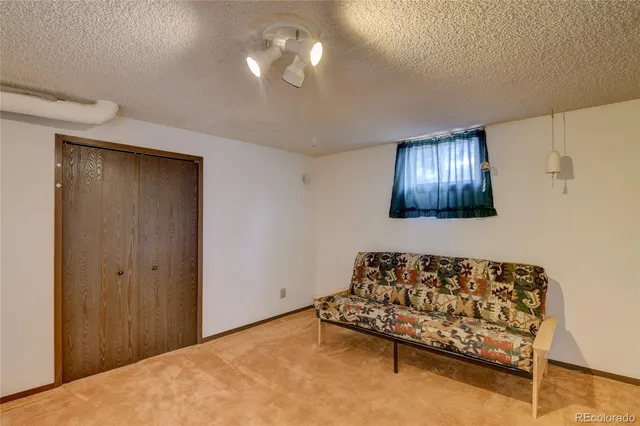 a living room with a couch and a flat screen tv