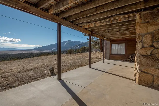 a view of balcony with wooden floor and city view