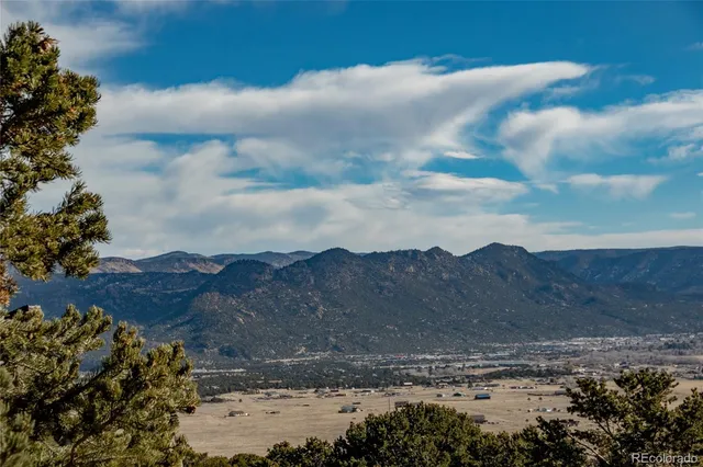 a spacious bedroom with a bed and a window