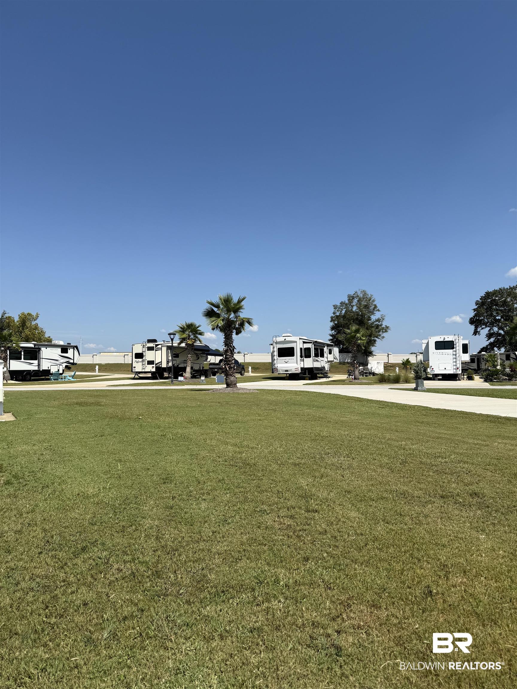 28086 Migratory Way Elberta, AL 36530 - Photo 7 of 46 View of property's community with a lawn