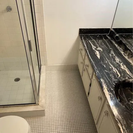 a bathroom with a sink and toilet