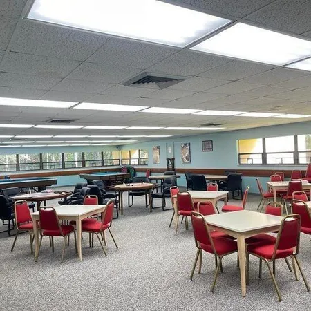 a view of a swimming pool with an outdoor seating