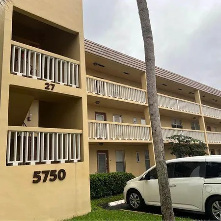 a view of a car park in front of a building