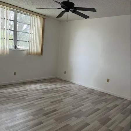 a living room with a couch and a window