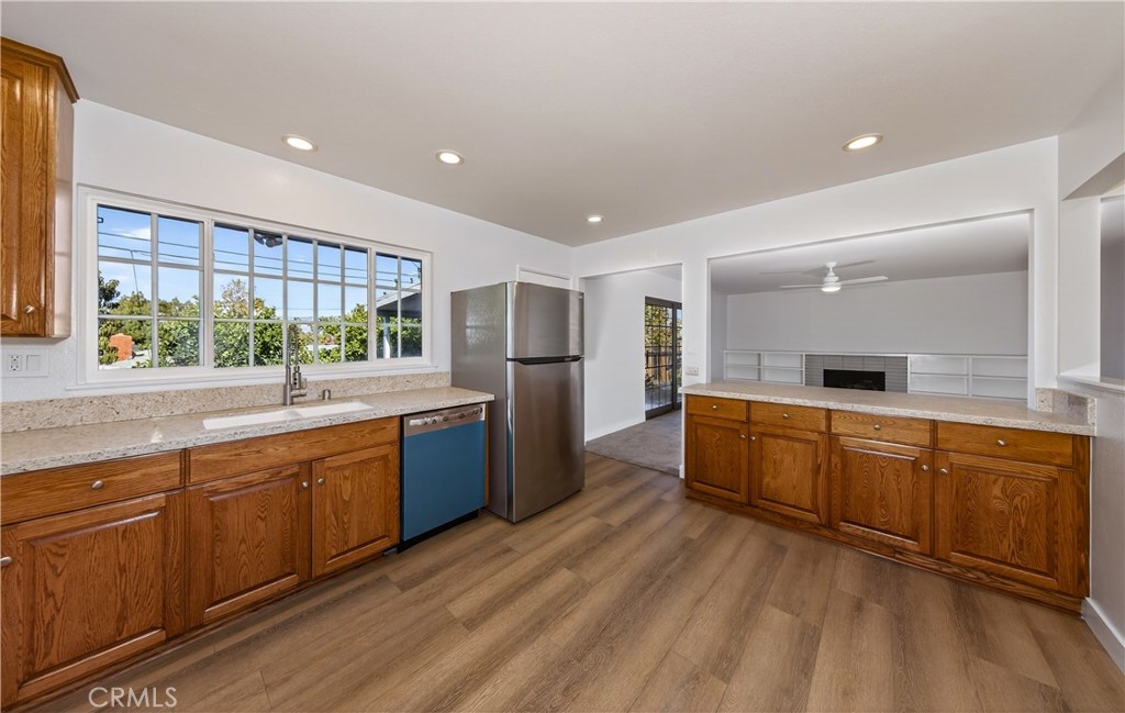 201 Primrose Avenue Redlands, CA 92373 - Photo 14 of 23 a large kitchen with stainless steel appliances granite countertop a large window a sink and cabinets
