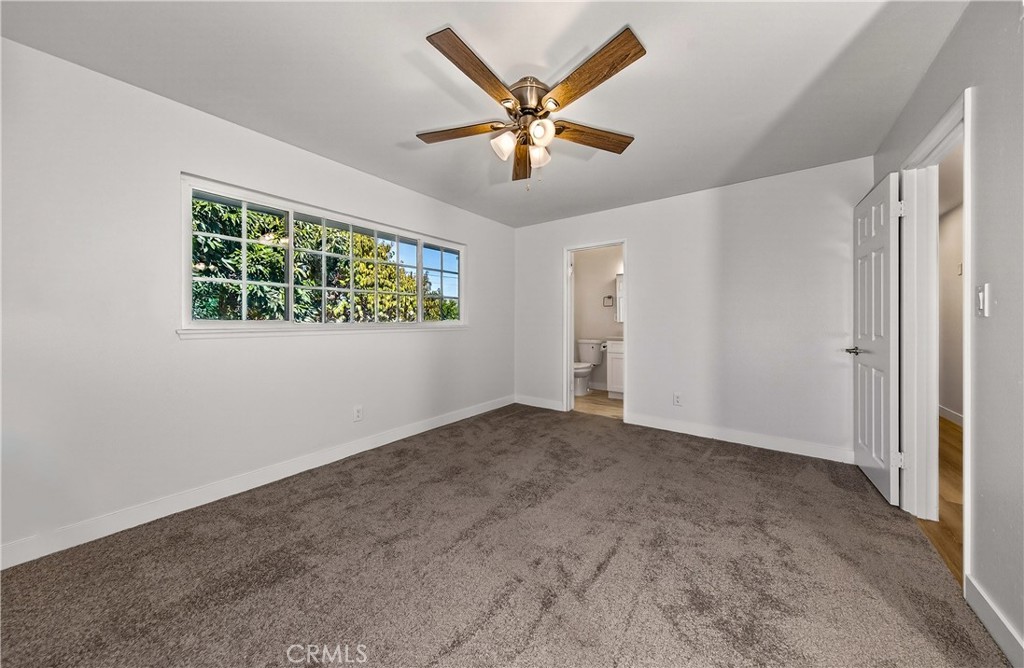 201 Primrose Avenue Redlands, CA 92373 - Photo 15 of 23 an empty room with windows and ceiling fan