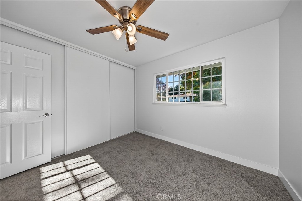 201 Primrose Avenue Redlands, CA 92373 - Photo 17 of 23 an empty room with windows and fan