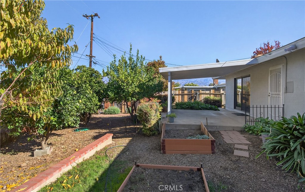 201 Primrose Avenue Redlands, CA 92373 - Photo 21 of 23 a front view of a house with garden