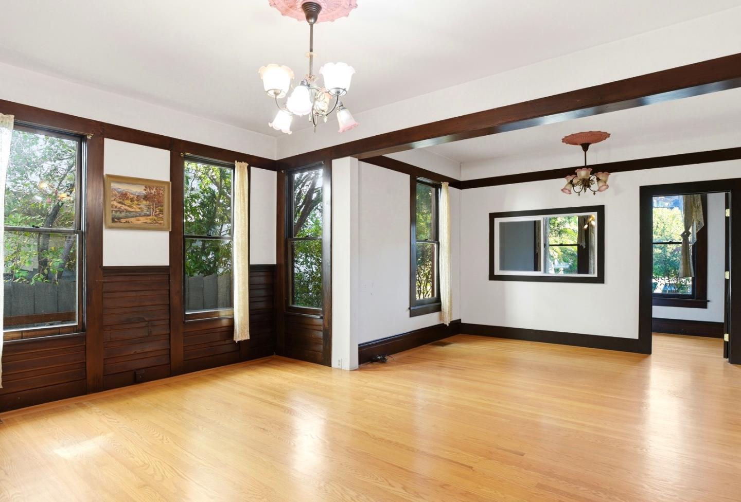 137 Elm Street San Mateo, CA 94401 - Photo 13 of 60 a view of an empty room with glass door and a window