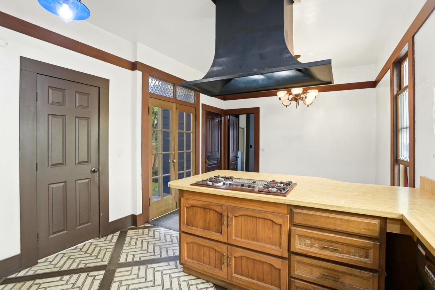 137 Elm Street San Mateo, CA 94401 - Photo 16 of 60 a bedroom with a bed and a dresser