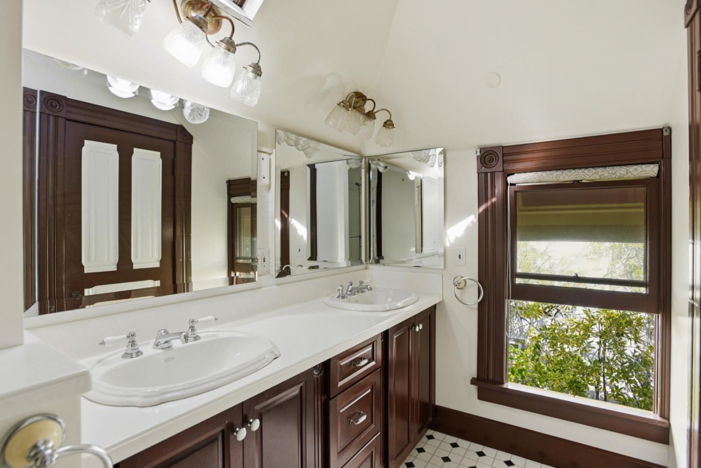 137 Elm Street San Mateo, CA 94401 - Photo 37 of 60 a bathroom with a sink double vanity granite and a large mirror