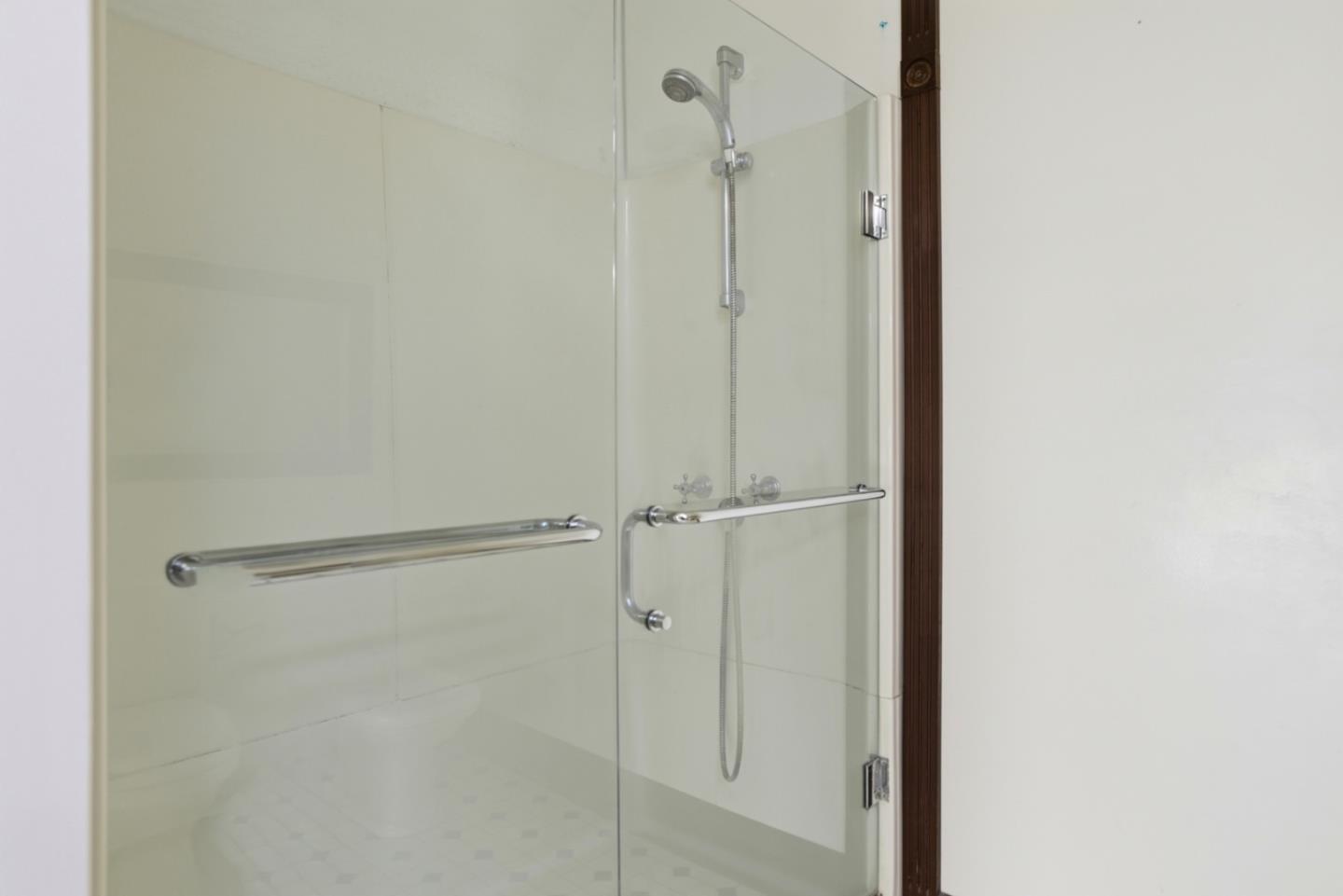 137 Elm Street San Mateo, CA 94401 - Photo 39 of 60 a bathroom with a glass shower door