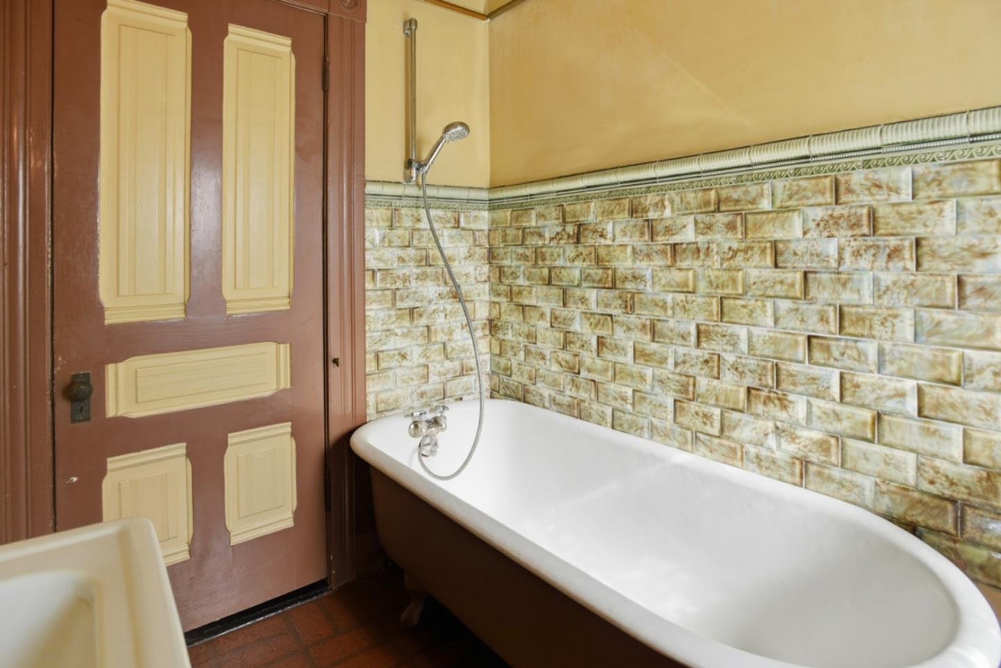 137 Elm Street San Mateo, CA 94401 - Photo 41 of 60 a bathroom with a bathtub and shower