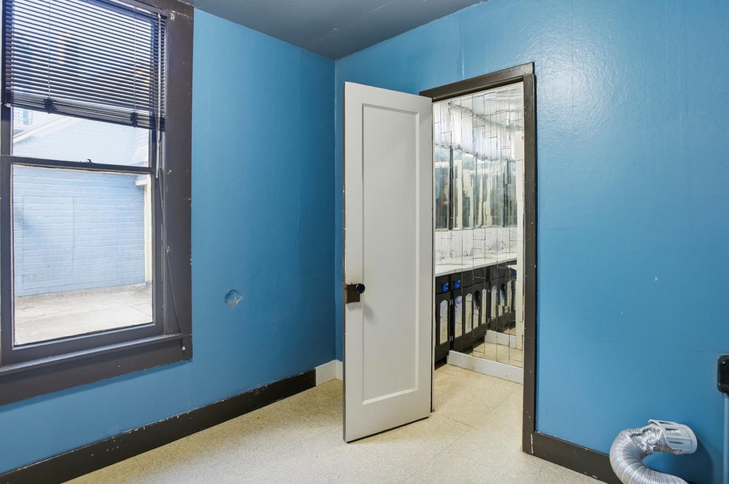 137 Elm Street San Mateo, CA 94401 - Photo 44 of 60 a view of a hallway with windows and entryway