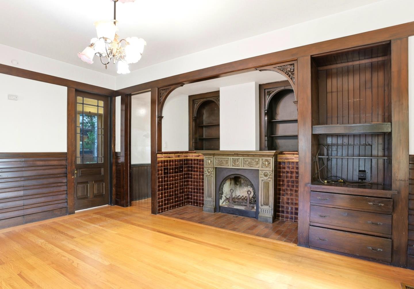 137 Elm Street San Mateo, CA 94401 - Photo 10 of 60 a bedroom with a bed and a fireplace