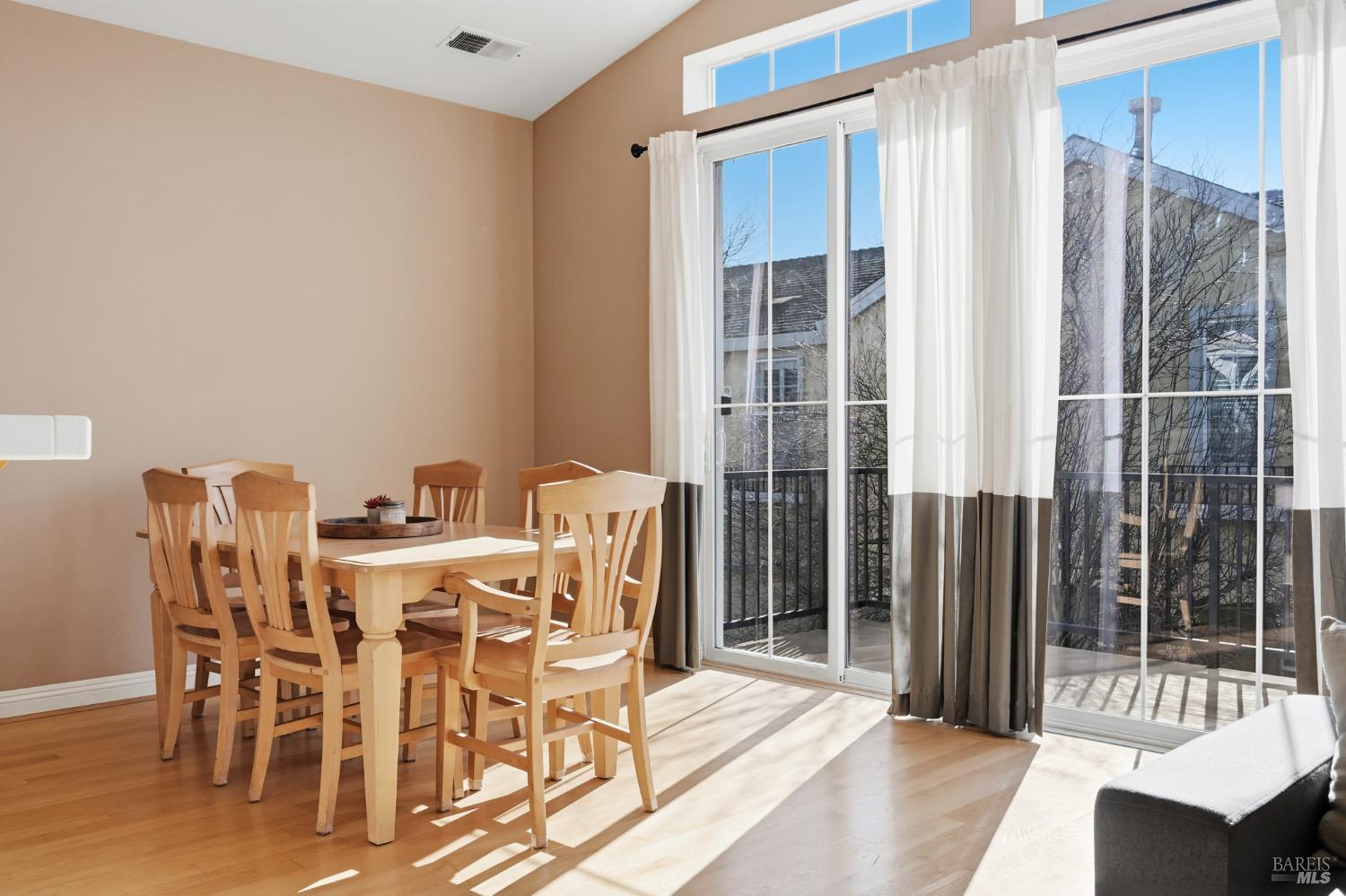 2983 Bay Village Avenue Santa Rosa, CA 95403 - Photo 19 of 35 a dining room with furniture and floor to ceiling window