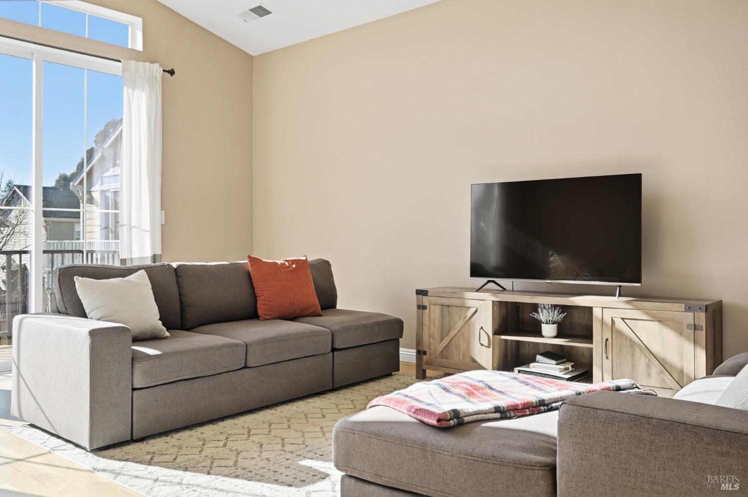 2983 Bay Village Avenue Santa Rosa, CA 95403 - Photo 23 of 35 a living room with furniture and a flat screen tv